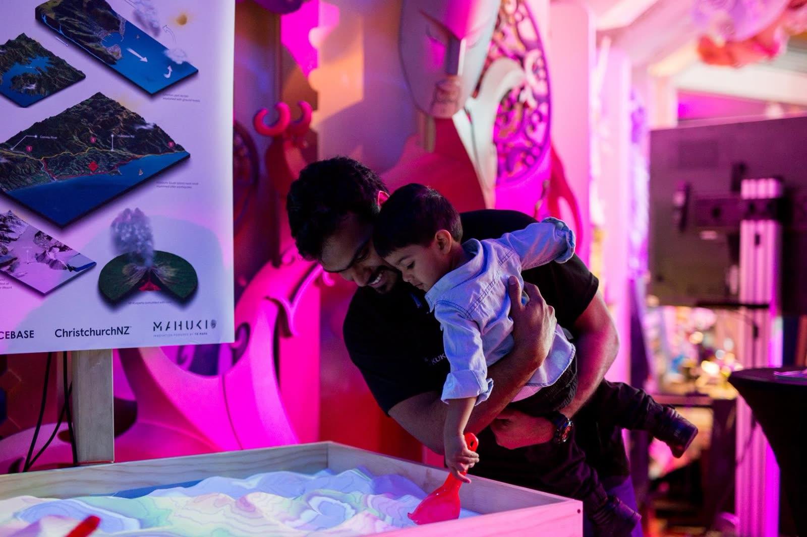 A visitor exploring the sandbox on demo day