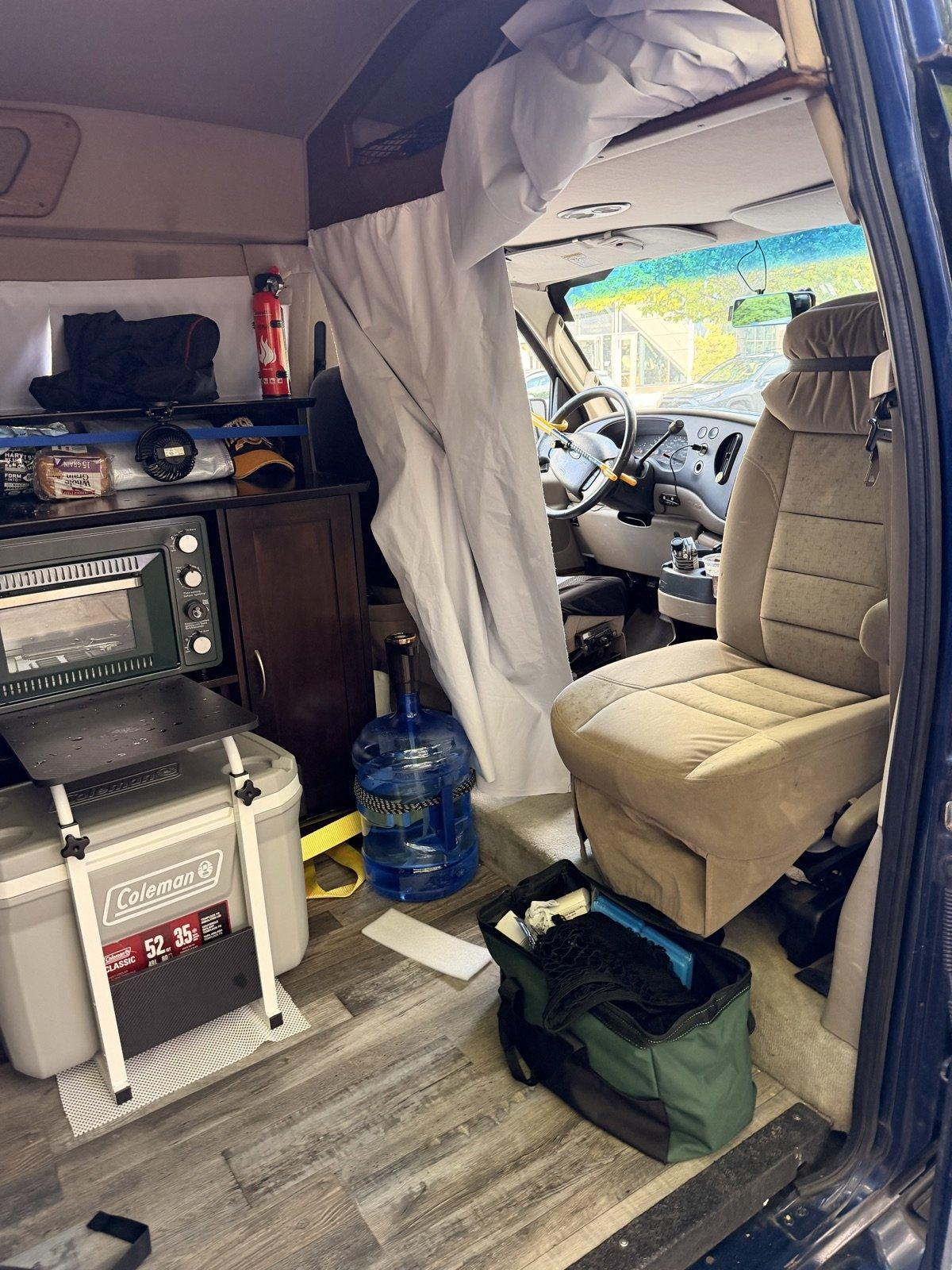 The passenger seat turning around is a blessing: one bolt-on kit and the cab becomes a lounge The swivelled passenger seat facing the living space