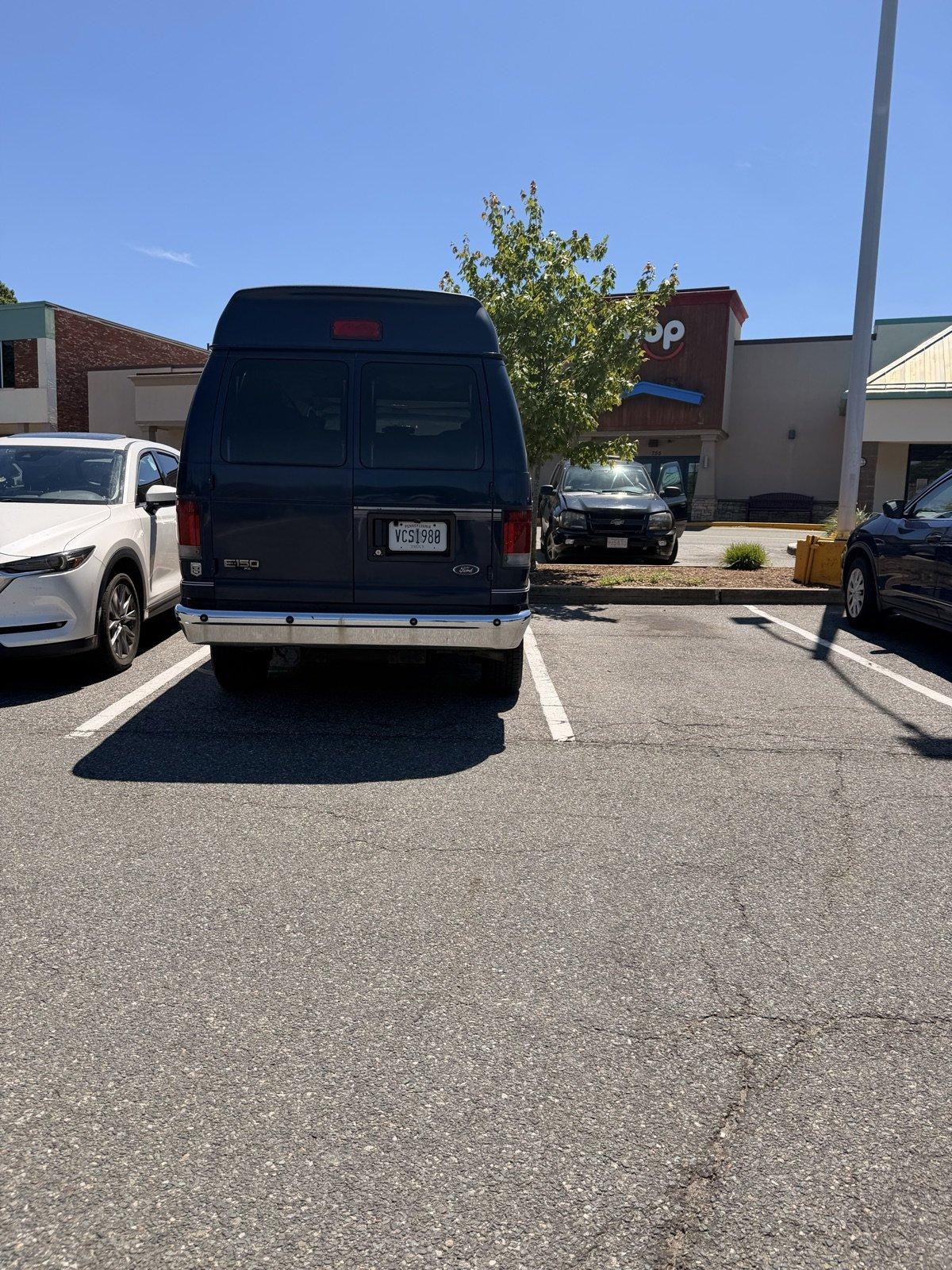 The van in its natural habitat: parked near a Planet Fitness The van parked near the gym